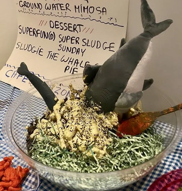 Graphic of a bowl/menu item titled Superfund Salad from Café Rezone campaign materials.