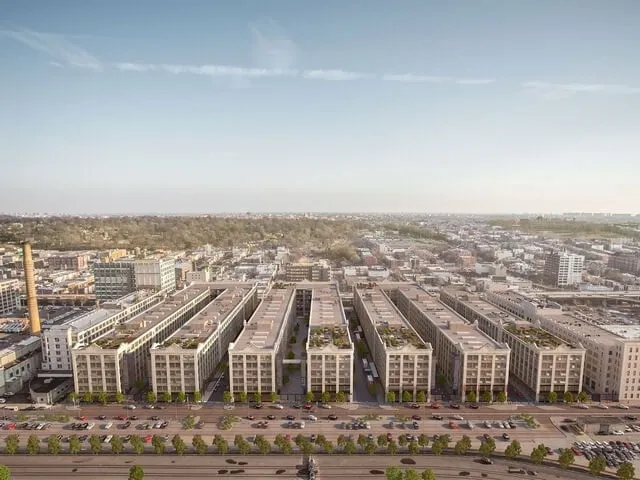 Aerial view or rendering of Industry City waterfront buildings.