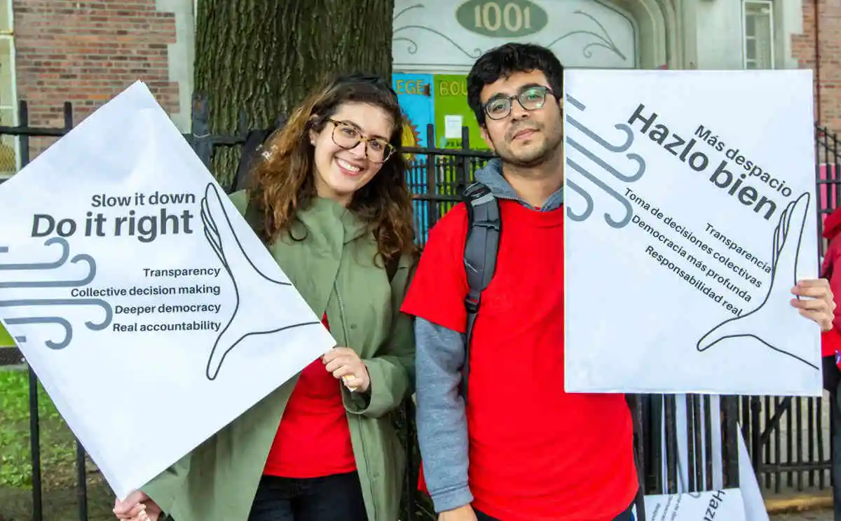 Group at rally with Bronx Brigade banner and resident signs.